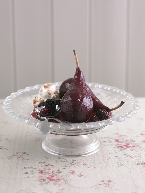 Poached pears in blackberry wine
